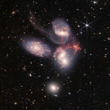 This cluster of galaxies, called Stephan’s Quintet, is a composite image produced from two cameras aboard the James Webb Space Telescope.